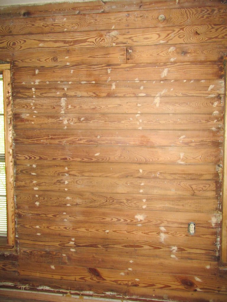 exposed shiplap with wood filler in nail holes